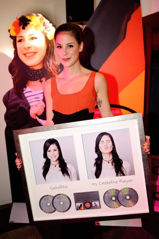 Lana Del Rey with framed memorabilia