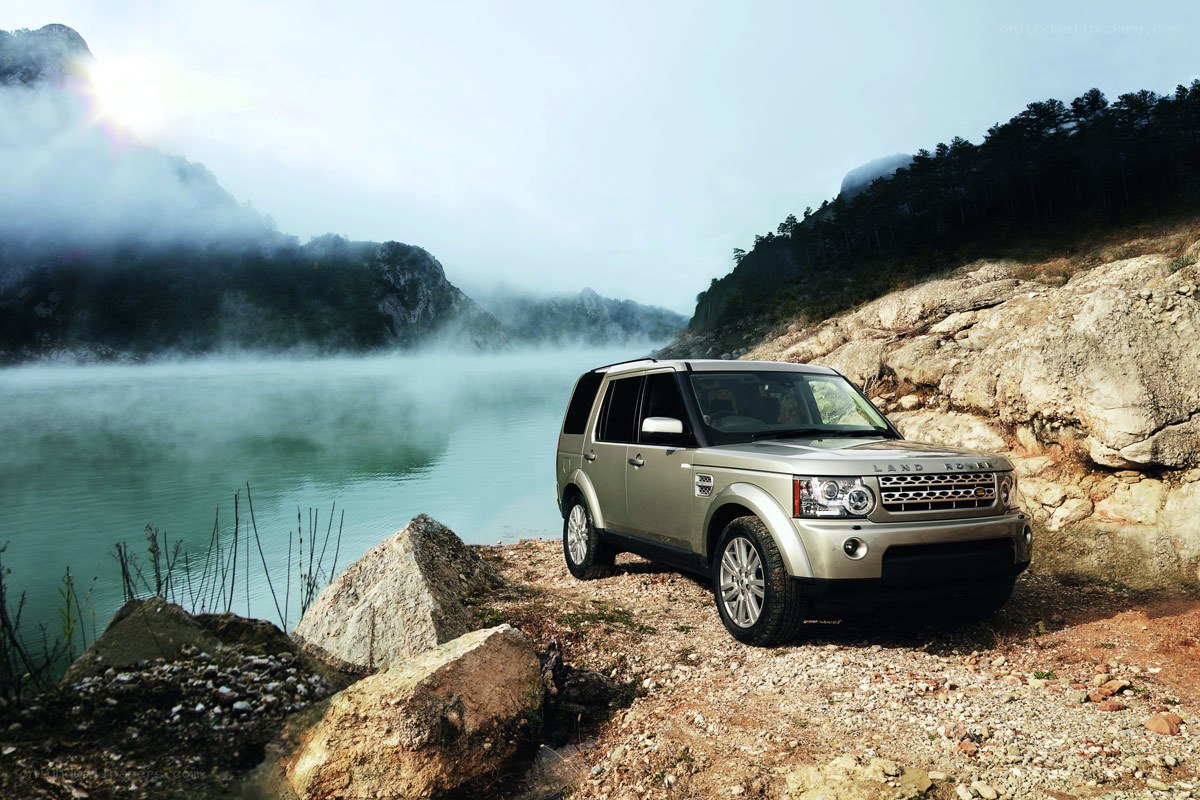 Land Rover by a misty lake