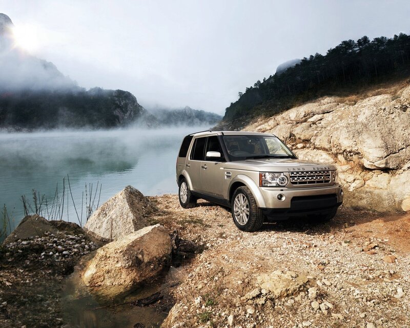 Land Rover by a misty lake