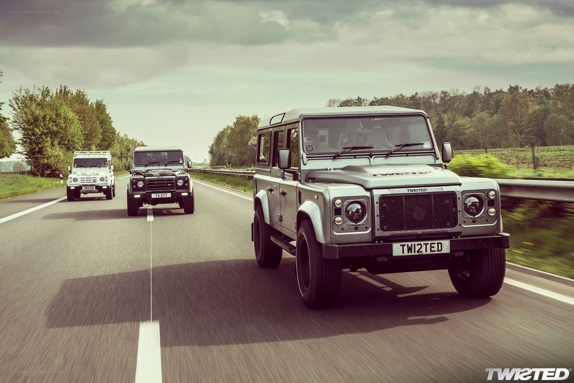 Land Rover convoy on a road