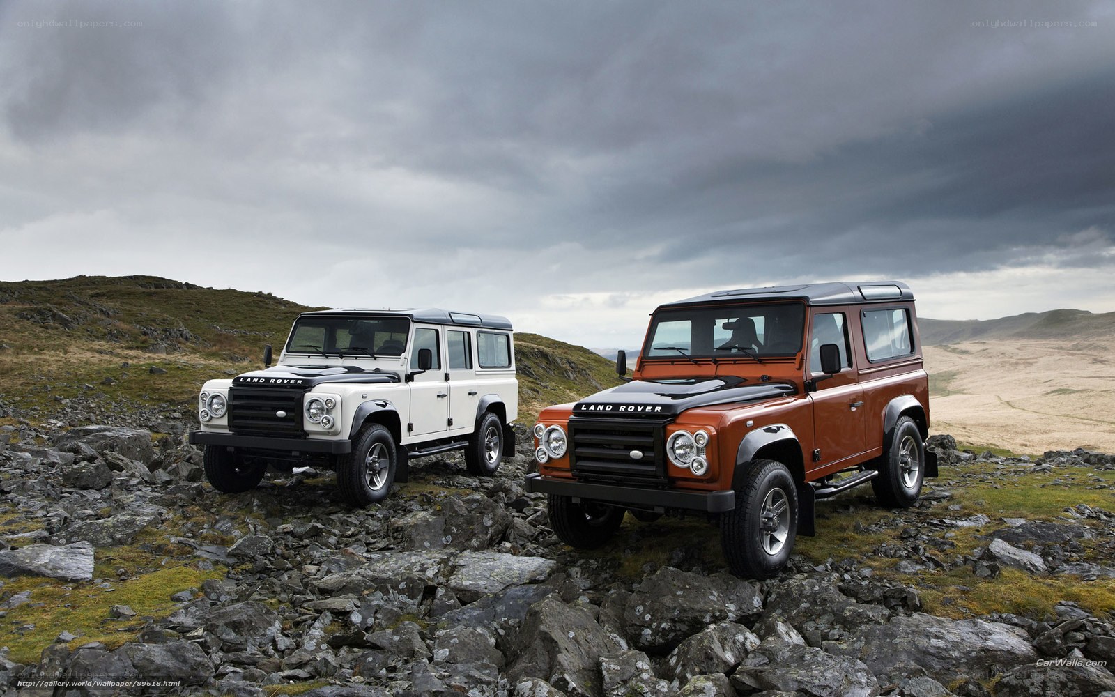 Land Rover Defenders on rocky terrain