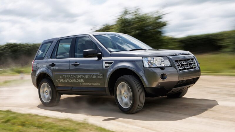 Land Rover driving on dirt road