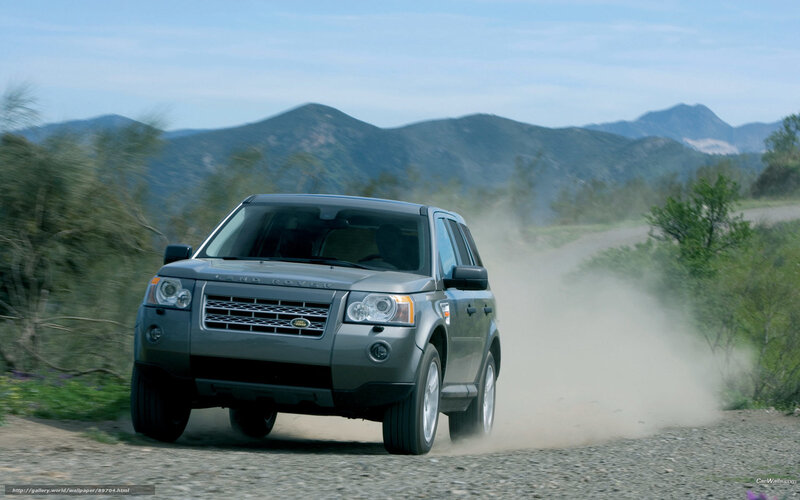 Land Rover driving on dirt road