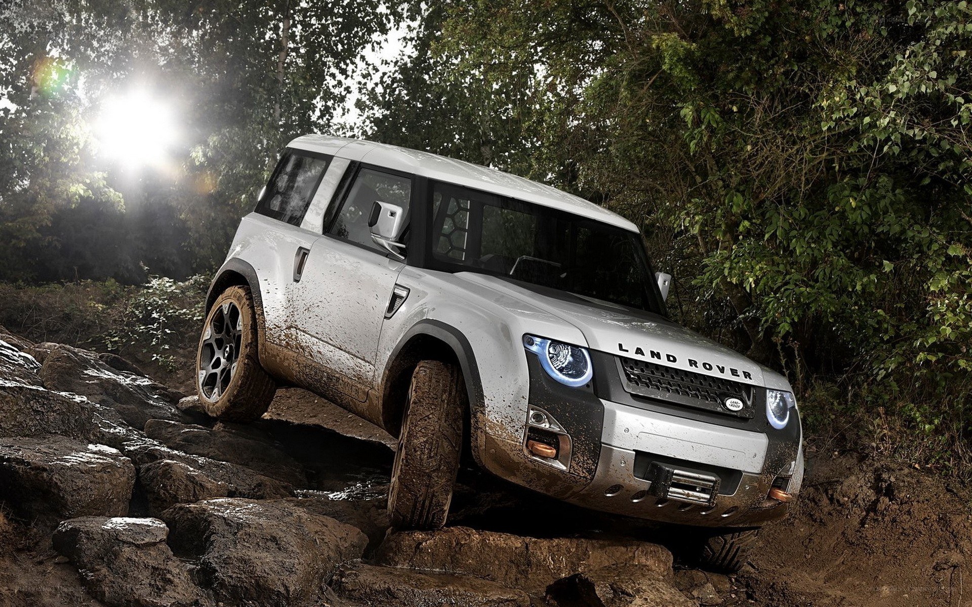 Land Rover driving over rocks