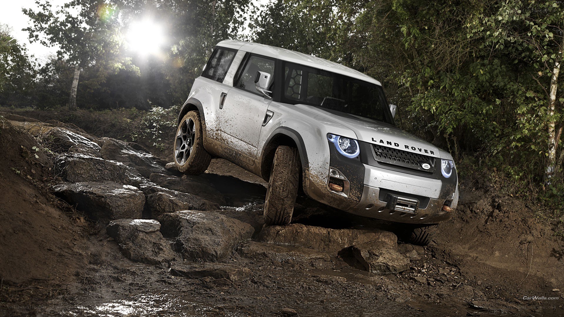 Land Rover driving over rocks