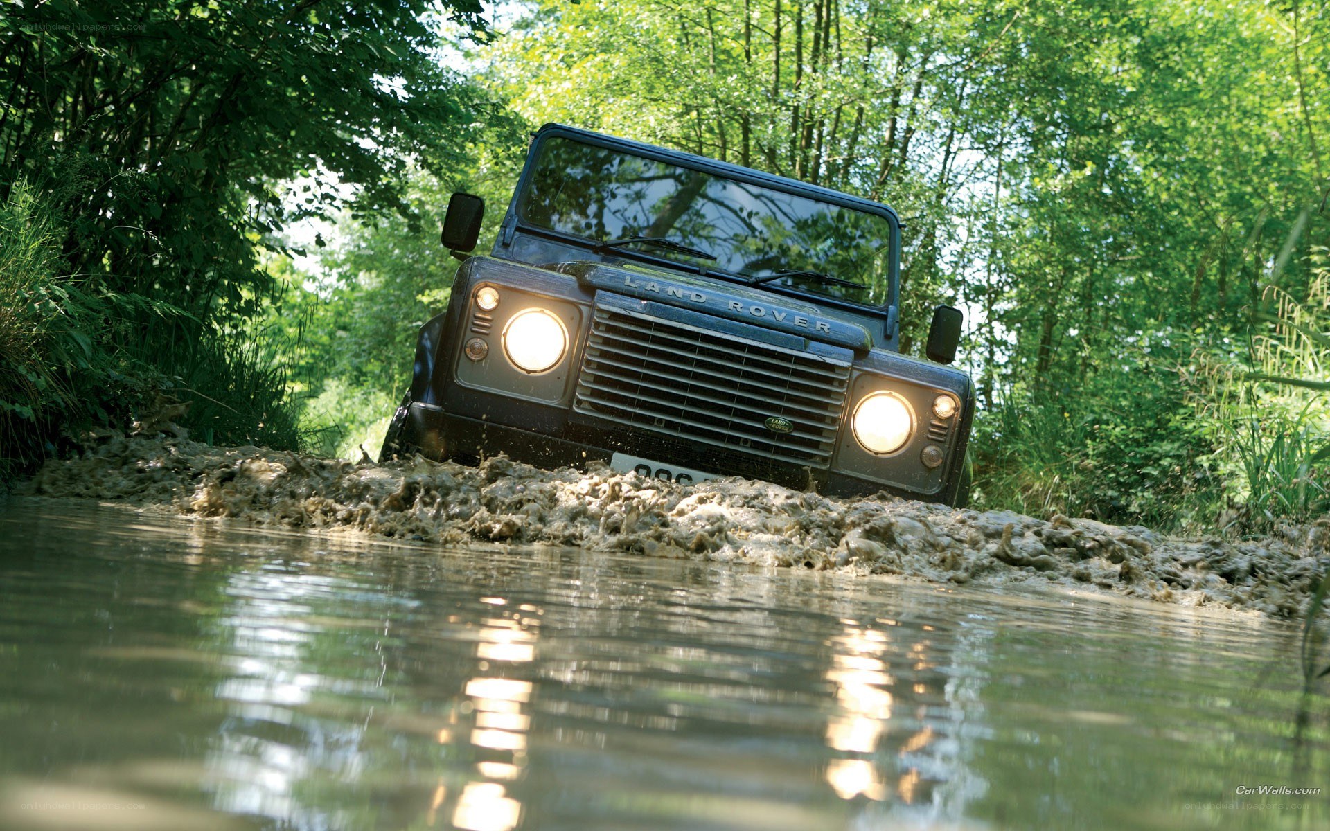 Land Rover driving through mud