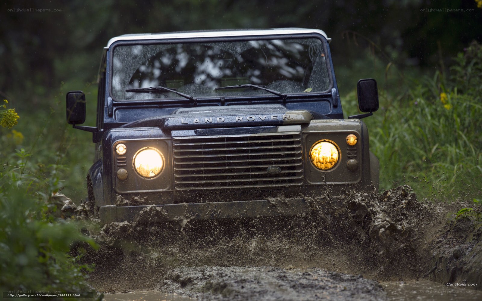 Land Rover driving through mud