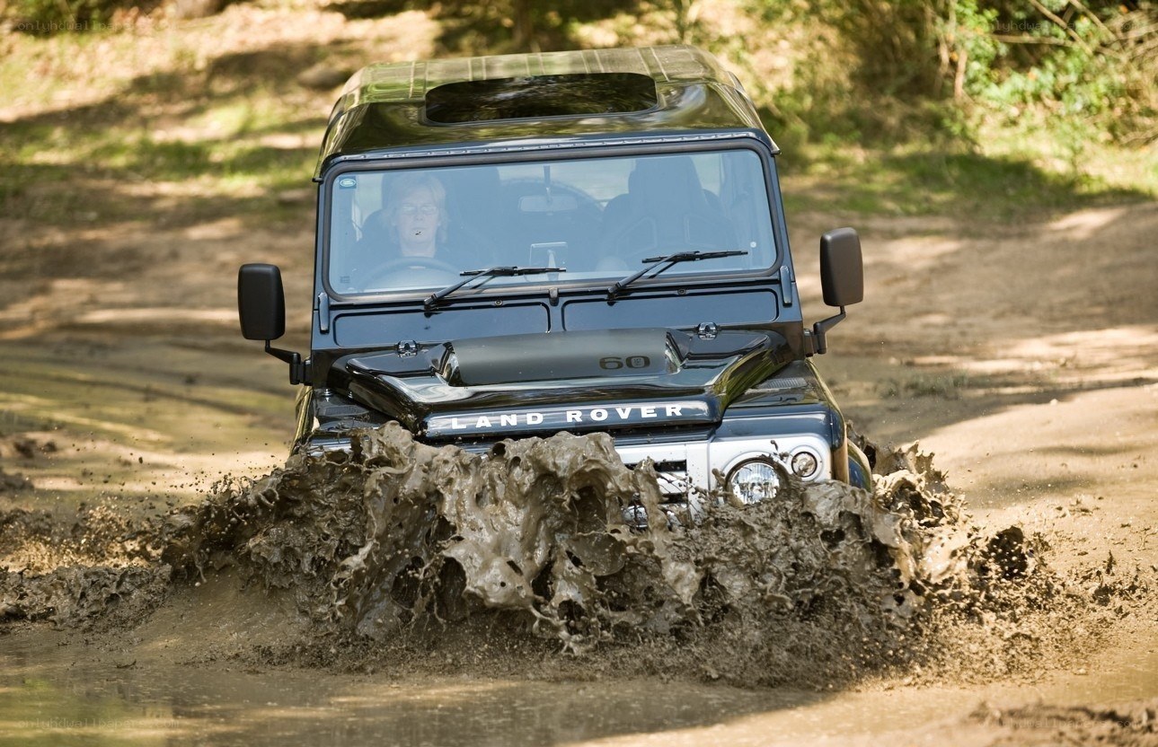 Land Rover driving through mud