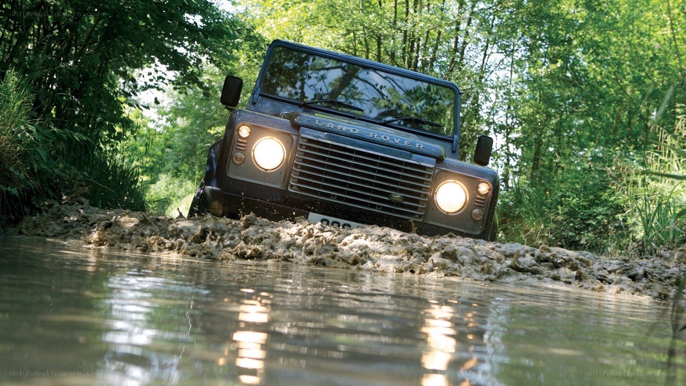 Land Rover driving through mud