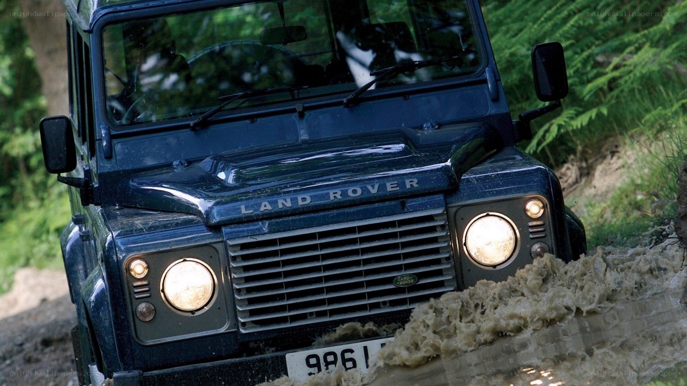 Land Rover driving through mud
