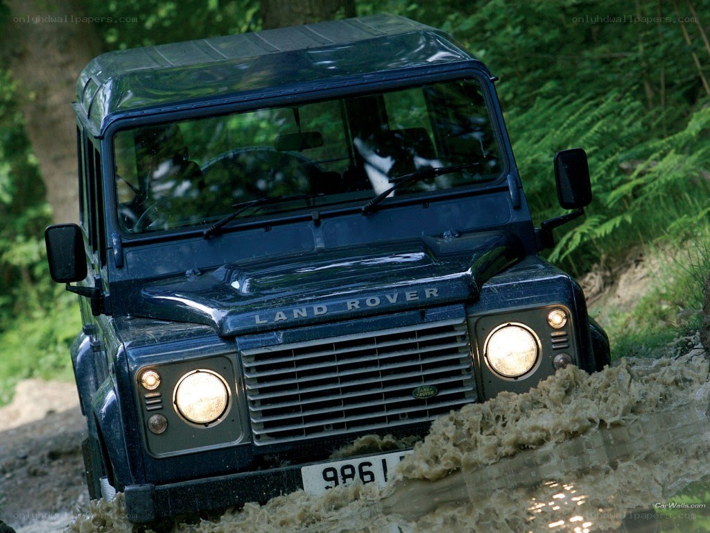 Land Rover driving through mud