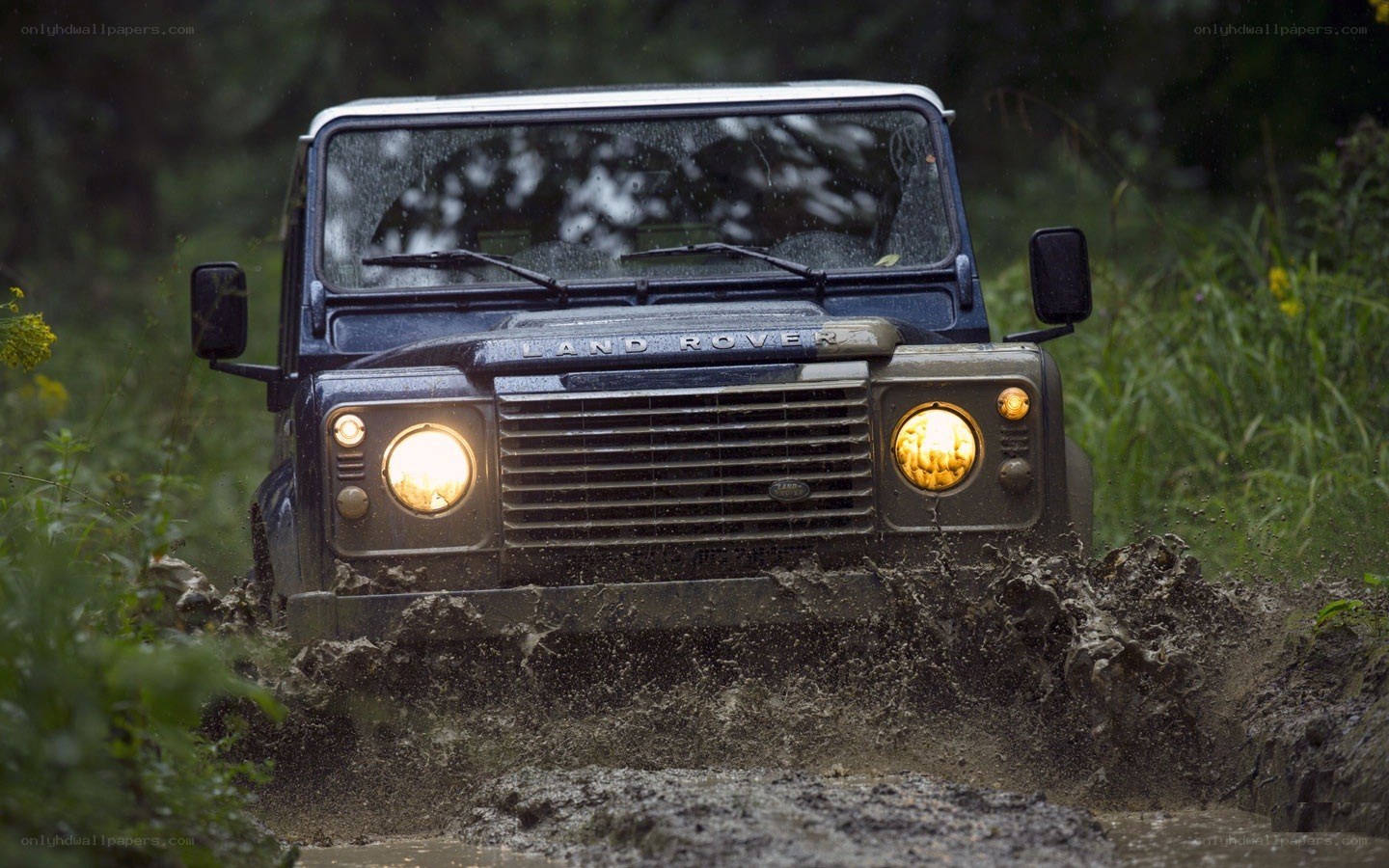 Land Rover driving through mud