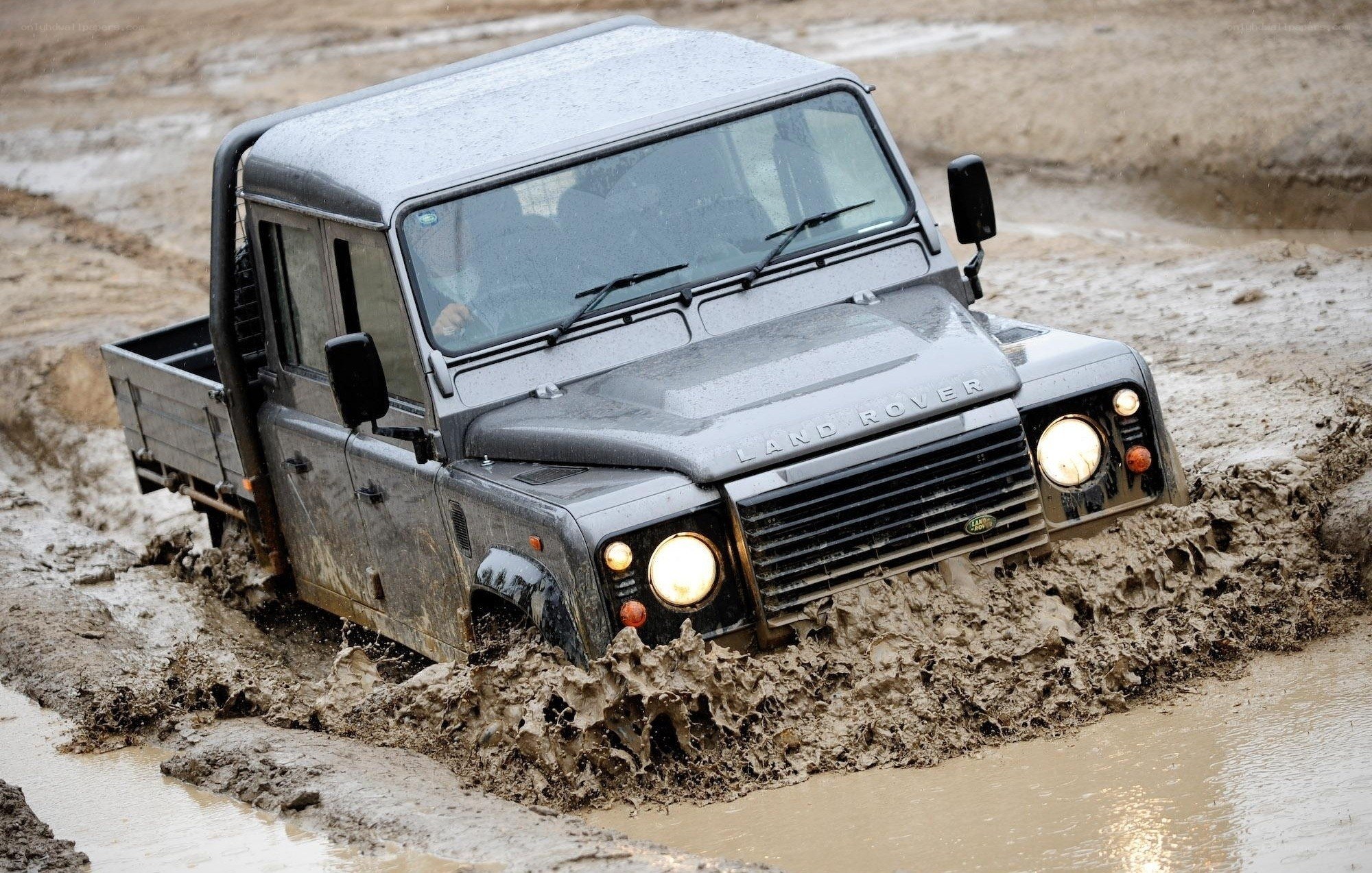 Land Rover driving through mud