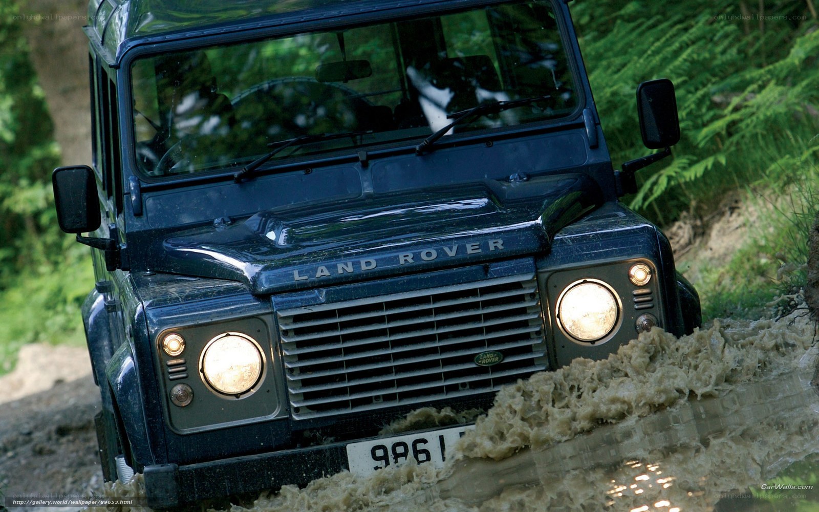 Land Rover driving through mud
