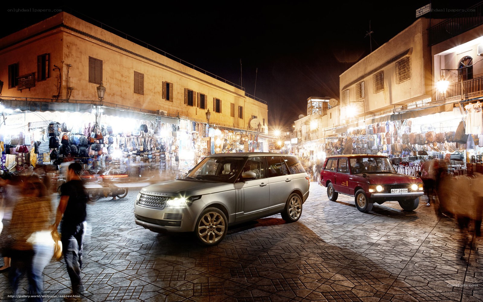 Land Rover in a bustling market