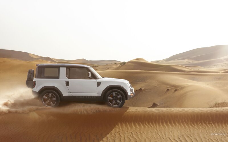 Land Rover in desert dunes