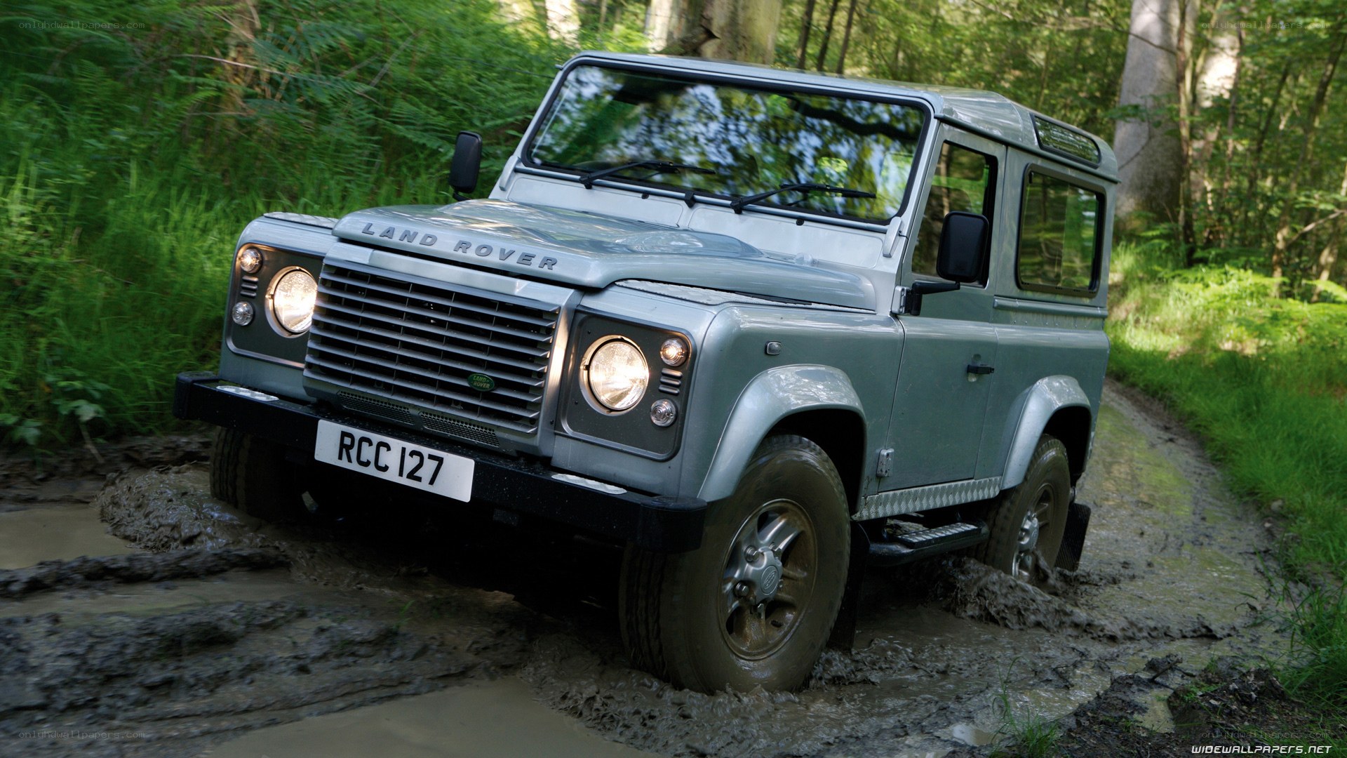 Land Rover in muddy forest