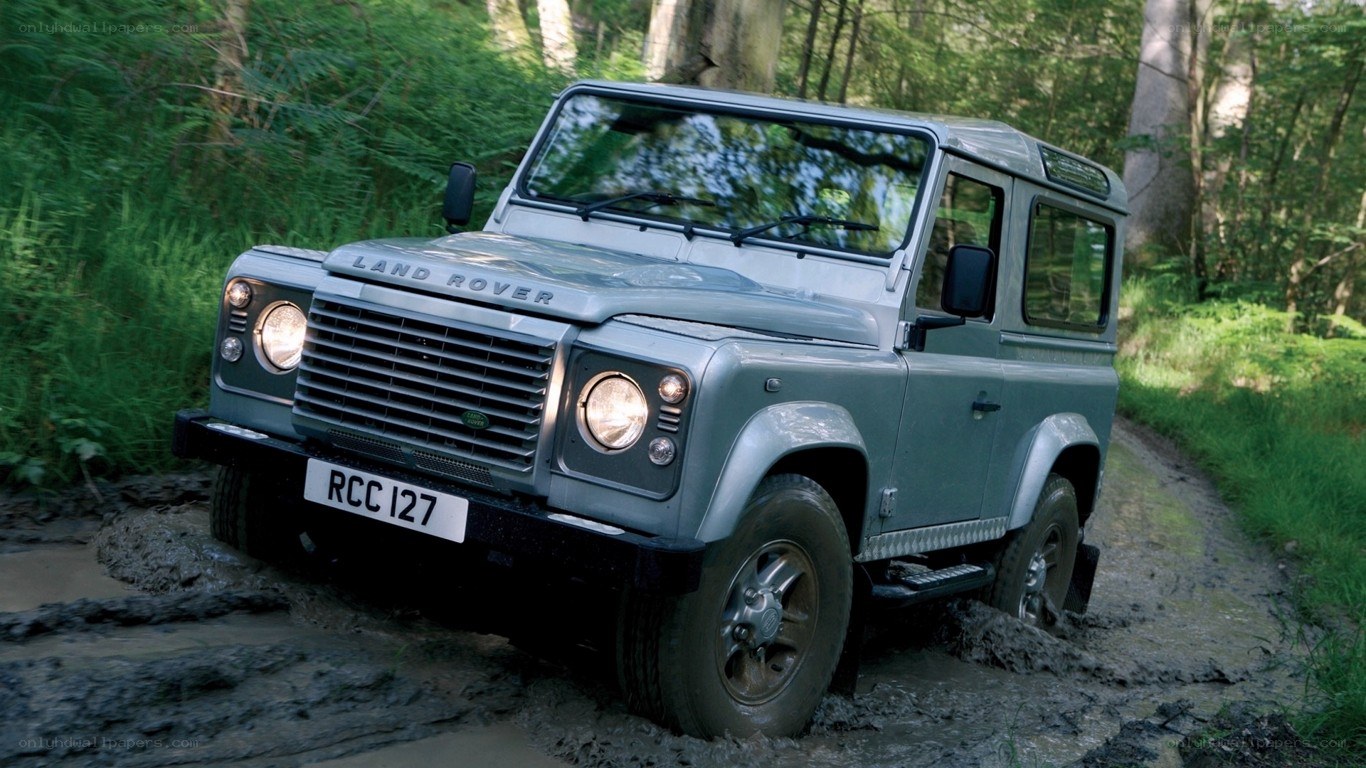 Land Rover in muddy forest