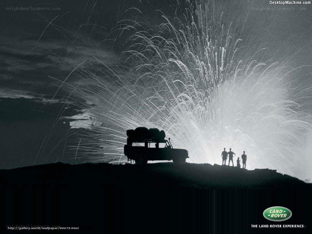 Land Rover silhouetted against eruption