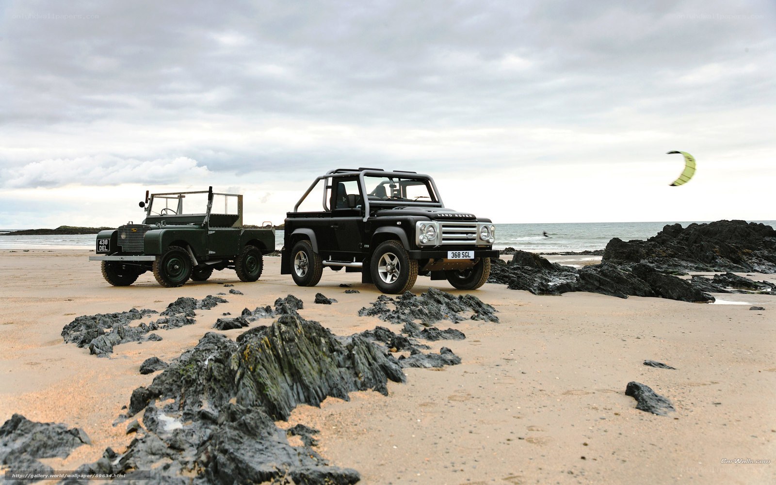 Land Rovers on a beach