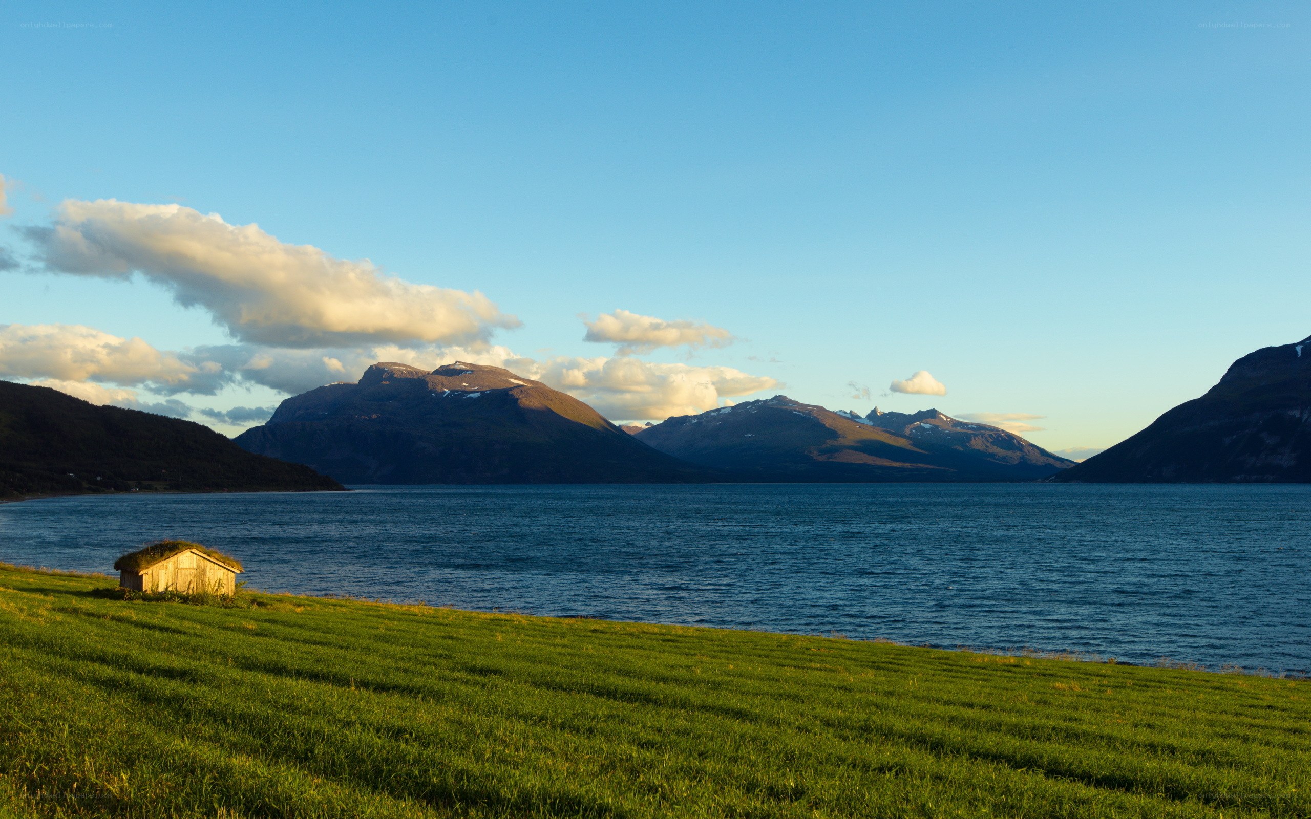Landscape with cabin and mountains