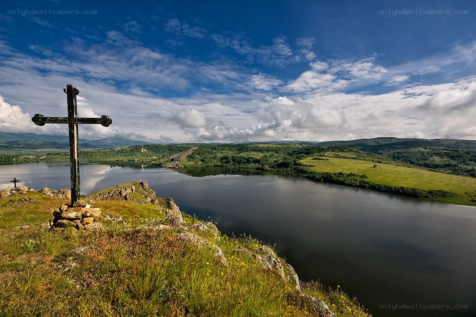 Landscape with cross and lake