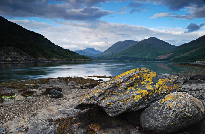 Landscape with rocky shore and mountains