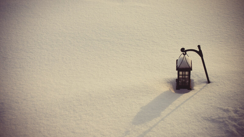 lantern in snowy landscape