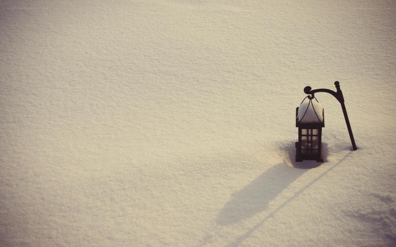lantern in snowy landscape