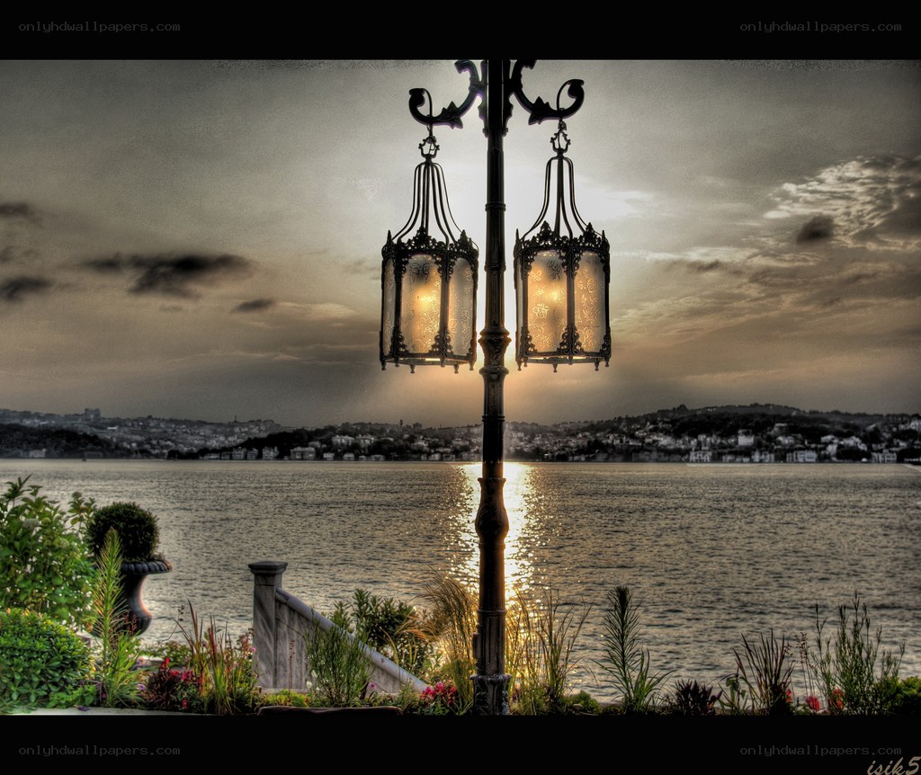 Lanterns by the water at sunset