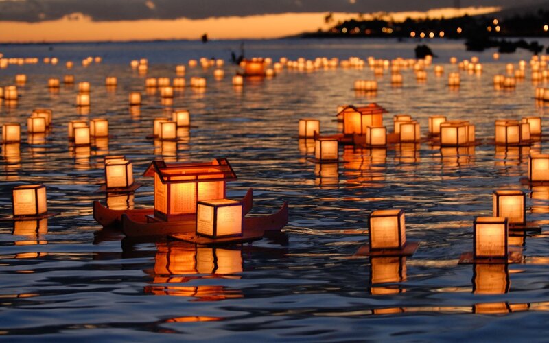 Lanterns Floating on Water — Orange, Serene, Sunset, Photograph, Sky, Lights, Boat, Blue, Black