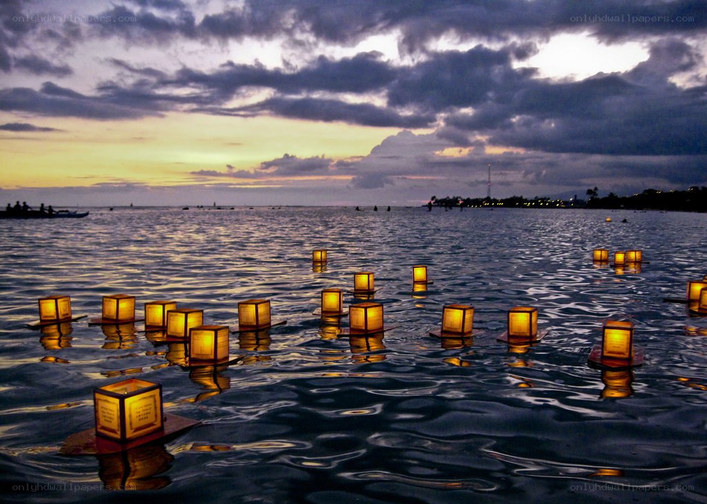 Lanterns on the water at dusk