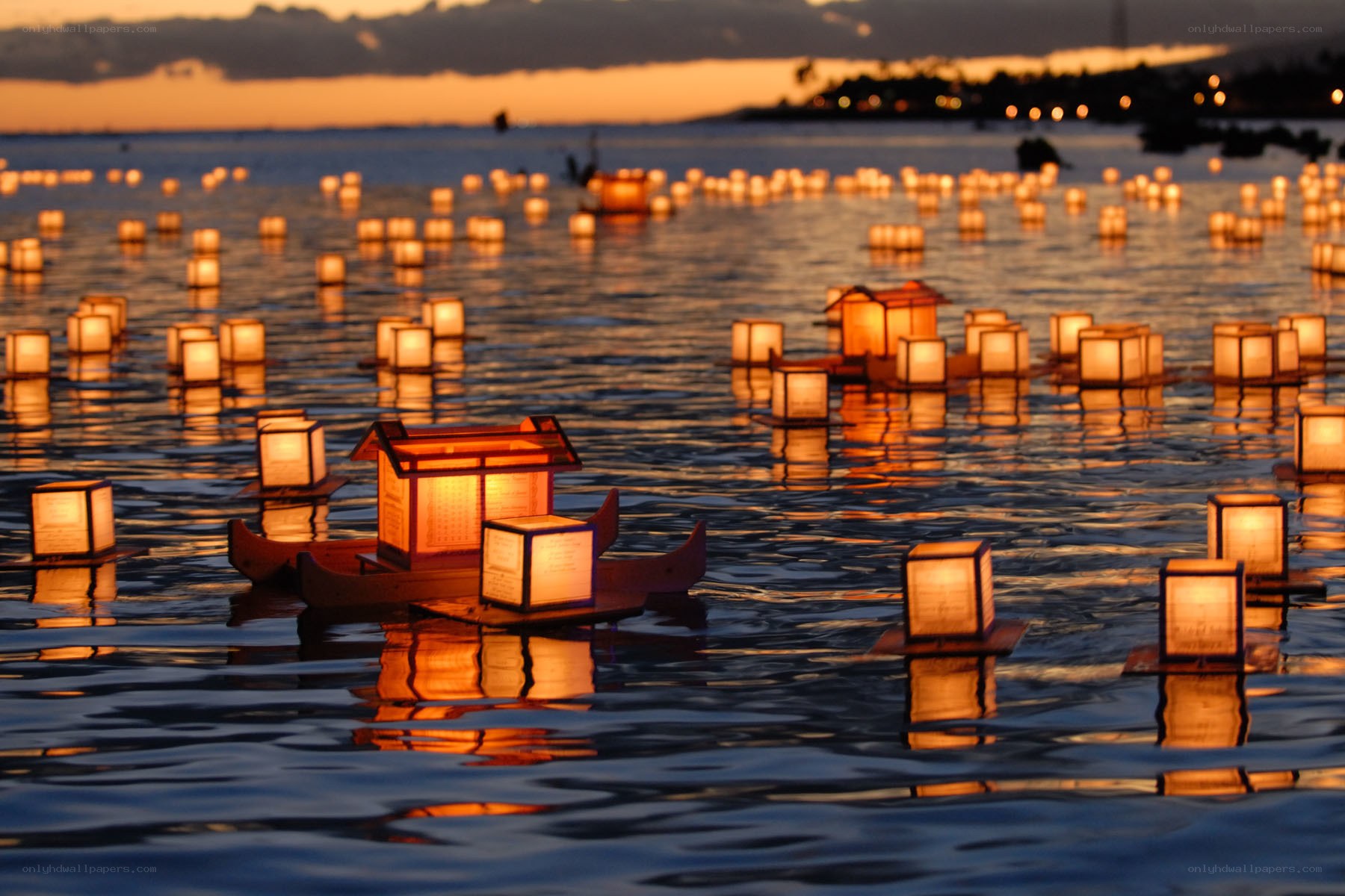 Lanterns on the water at dusk