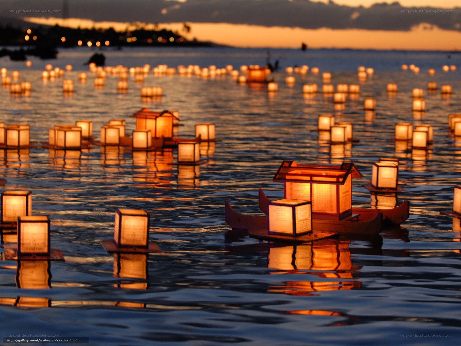 Lanterns on the water at dusk