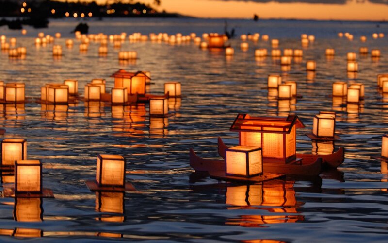 Lanterns on water at dusk