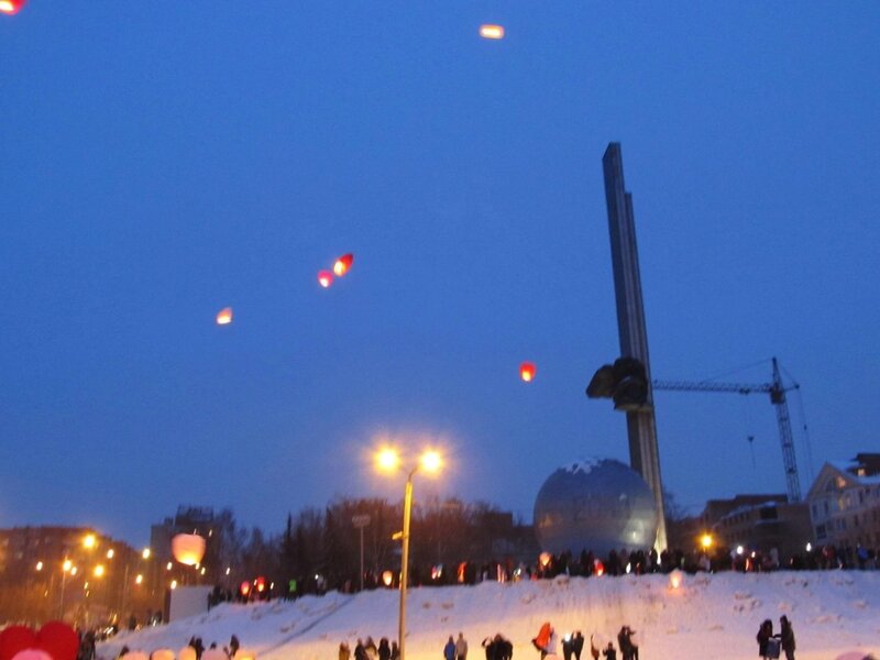 Lanterns over snowy monument