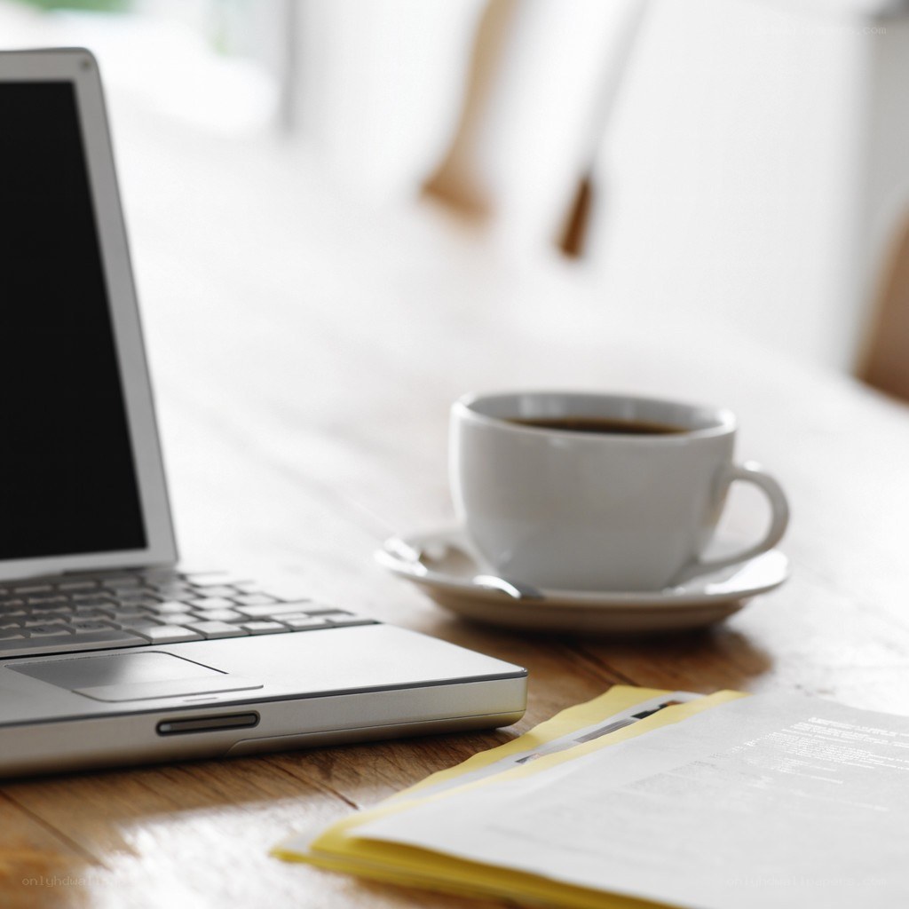 laptop and coffee on desk