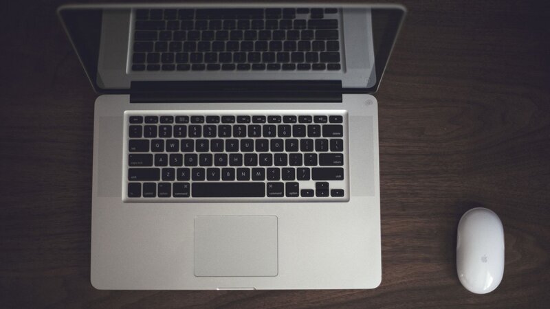laptop and mouse on desk
