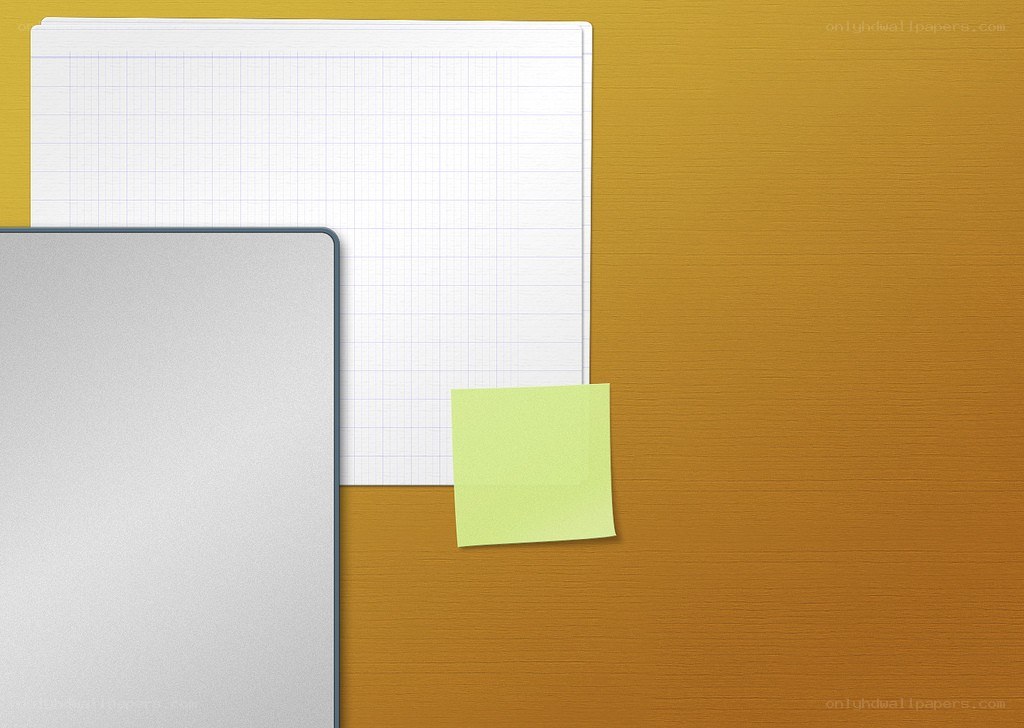laptop and notepad on desk