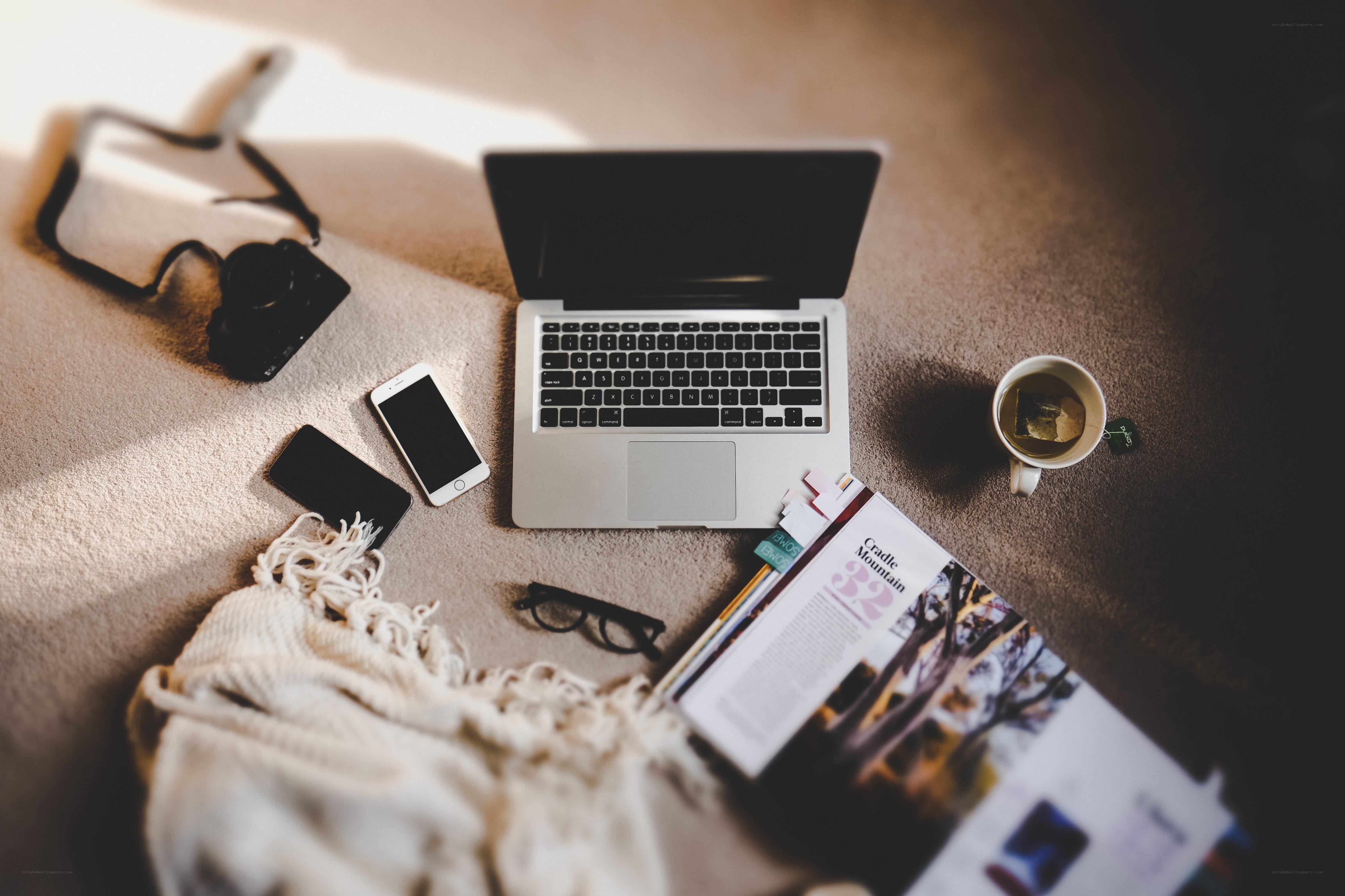 laptop and personal items on carpet