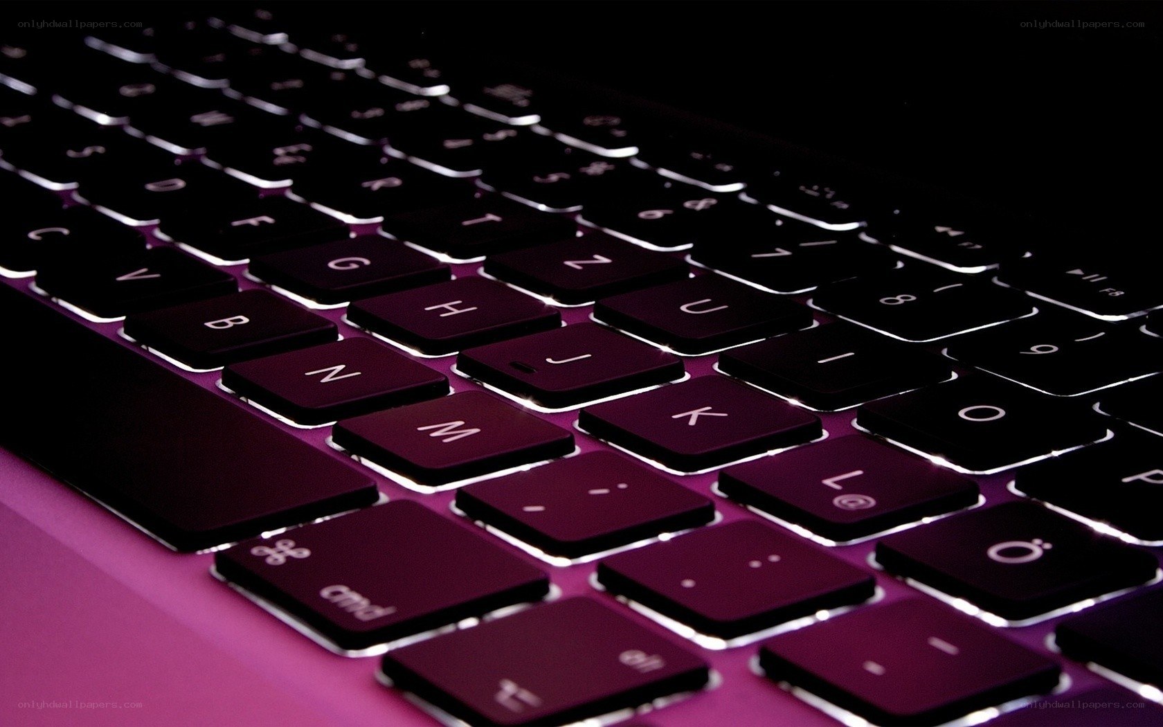 laptop keyboard with purple backlight