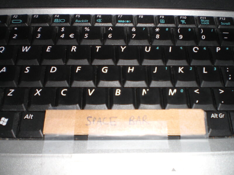 laptop keyboard with tape label