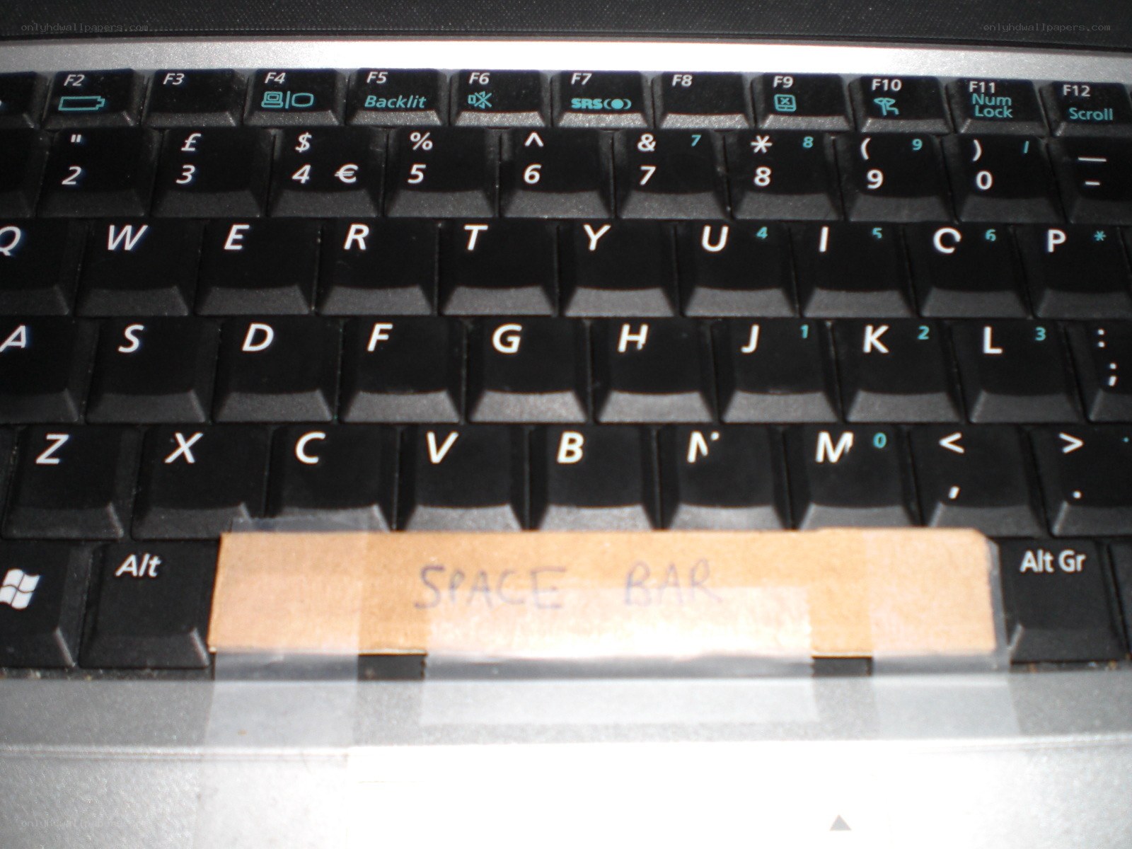 laptop keyboard with tape label