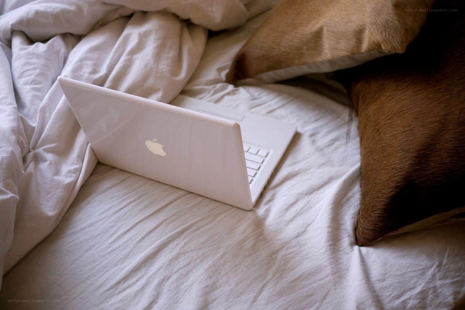 Laptop on a bed