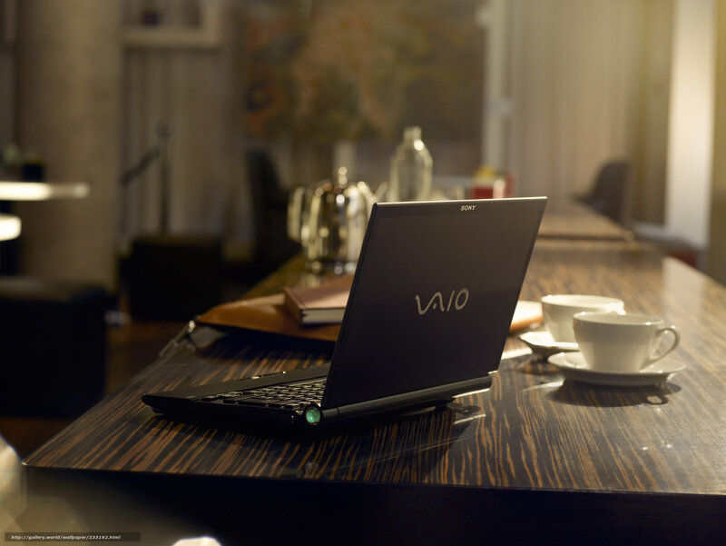 Laptop on a wooden table