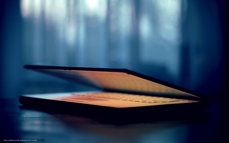 laptop on dark surface
