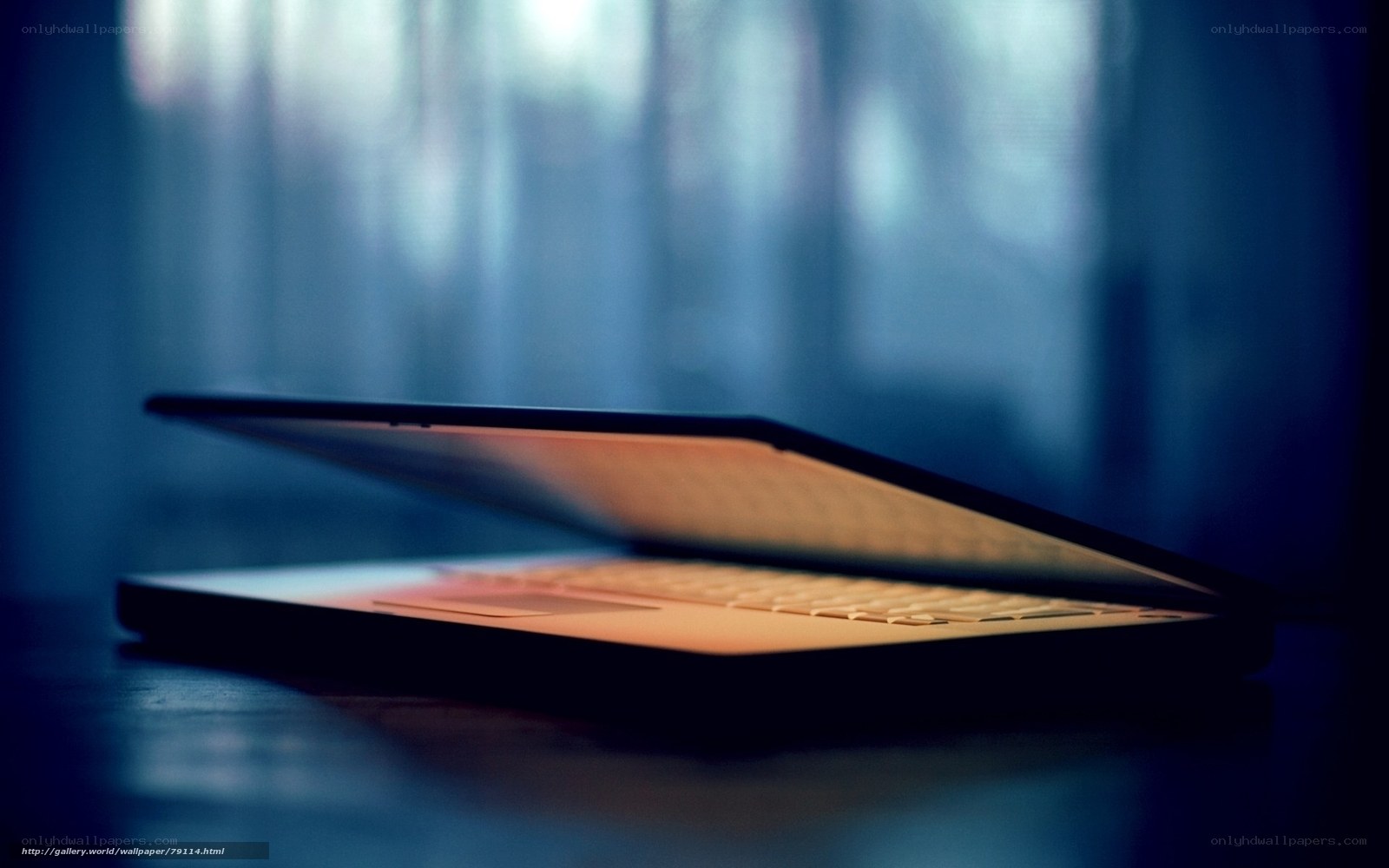 laptop on dark surface