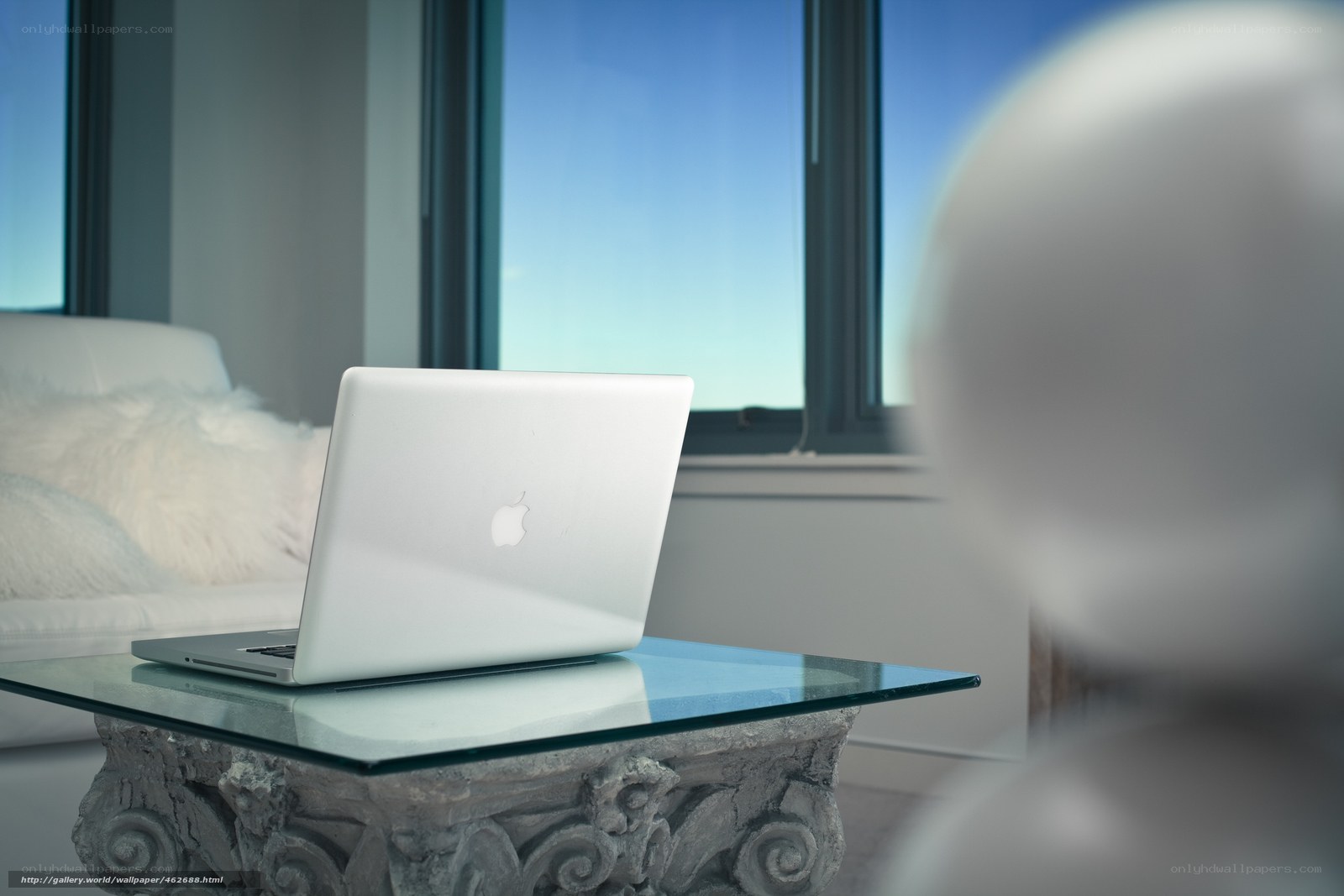 Laptop on glass table