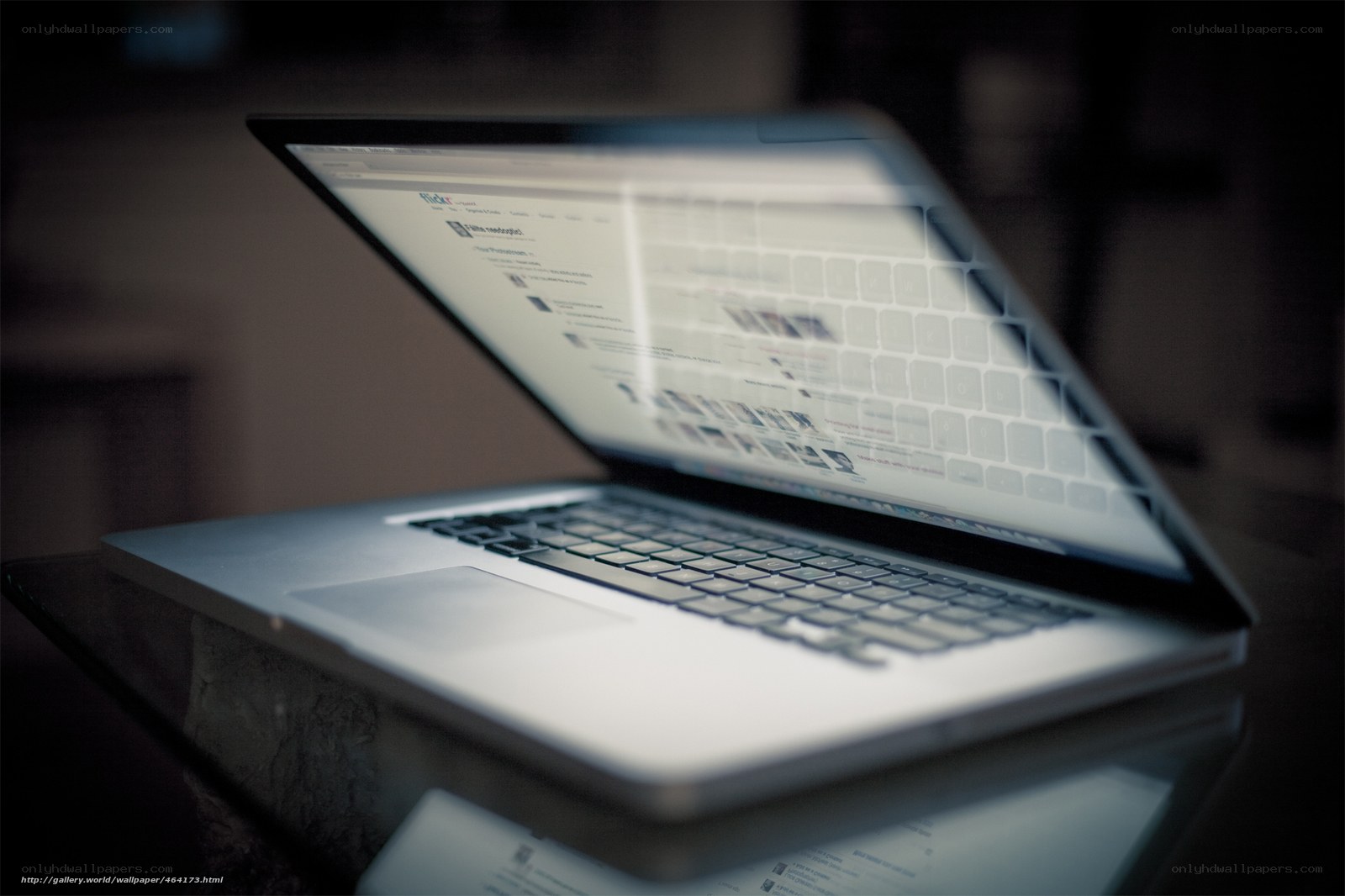 laptop on glass table
