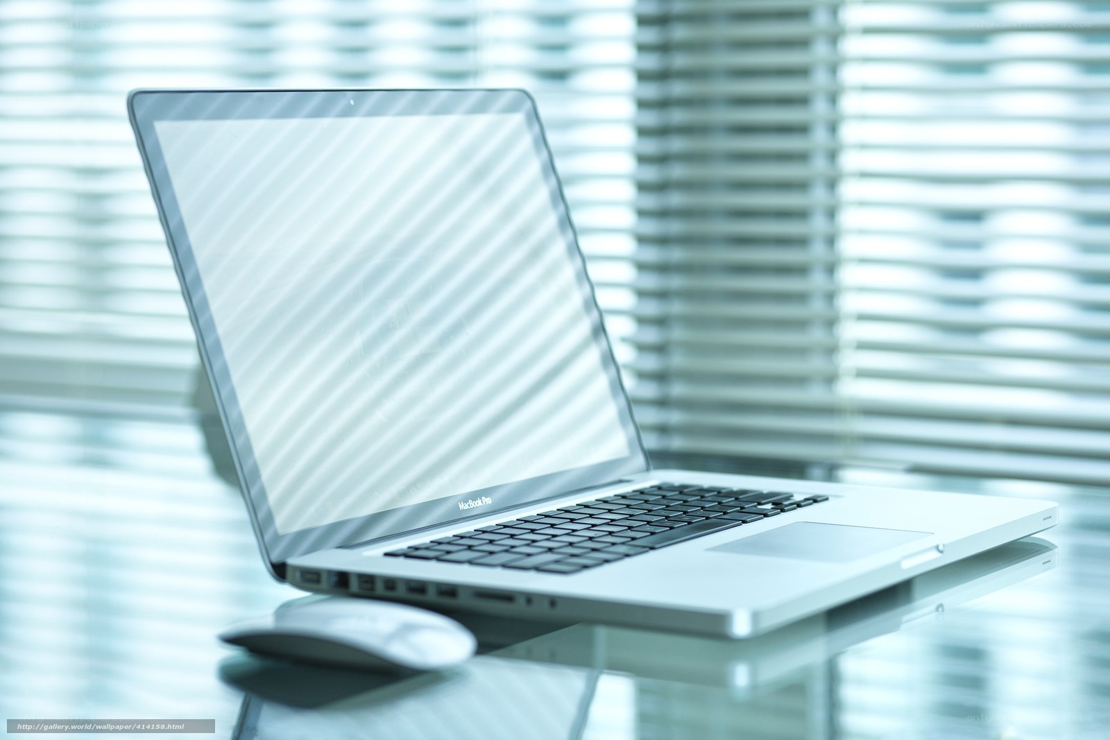 laptop on glass table